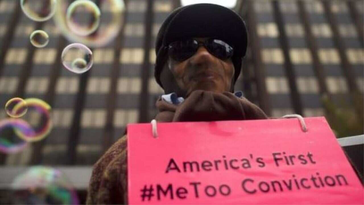 A man outside the courthouse where Bill Cosby was sentenced.