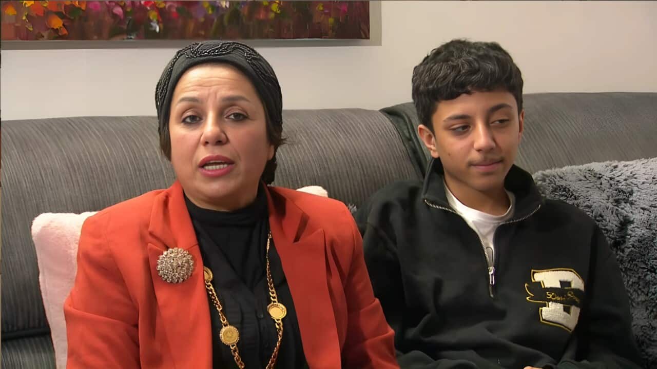 Ashwaq Shallal and one of her sons (SBS).jpg
