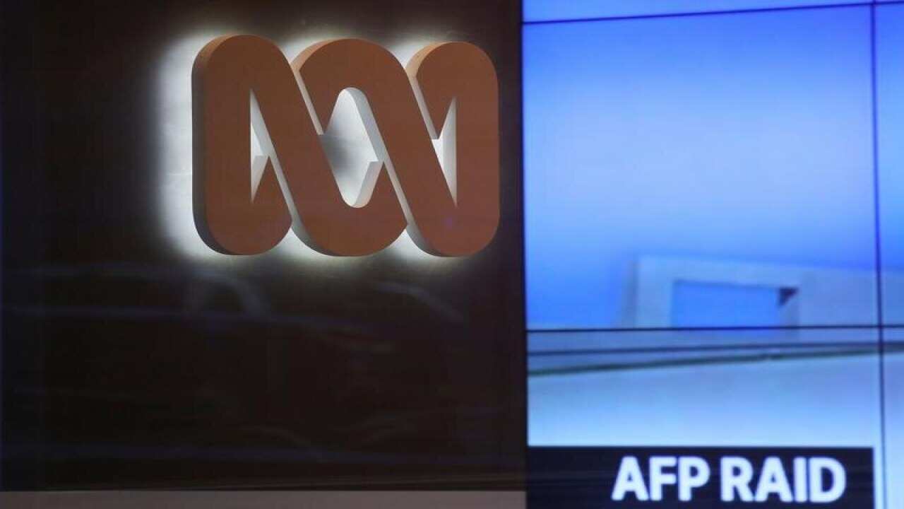 The logo of the ABC can be seen next to a screen.