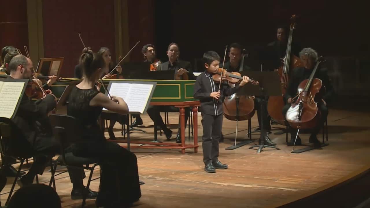 Australian Christian Li, 10, won a junior prize at an international violin competition.