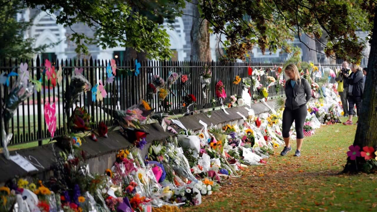 Mourners paying their respects at a makeshift memorial at the Botanical Gardens in Christchurch, New Zealand, Saturday, March 16, 2019.