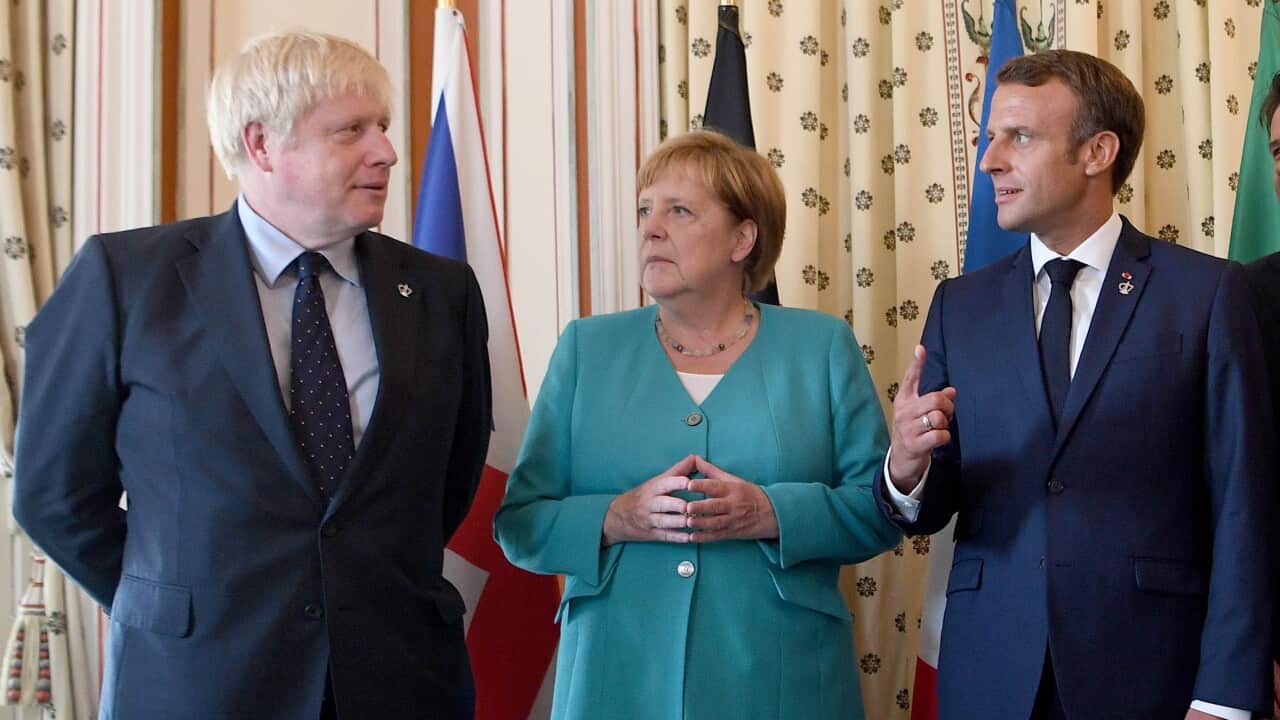 Boris Johnson (left) with German Chancellor Angela Merkel and French President Emmanuel Macron at the EU meeting during the G7 summit in France.