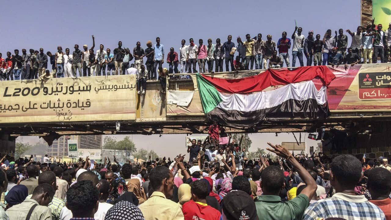 Protesters rally near the military headquarters,in the capital Khartoum, Sudan.