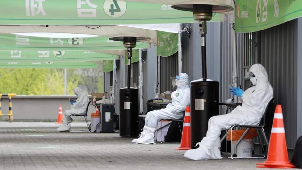 Staff at a drive-through testing centre