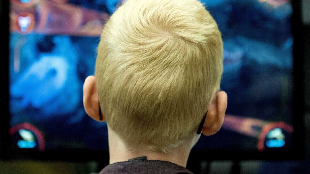 A gamer tries out a video game