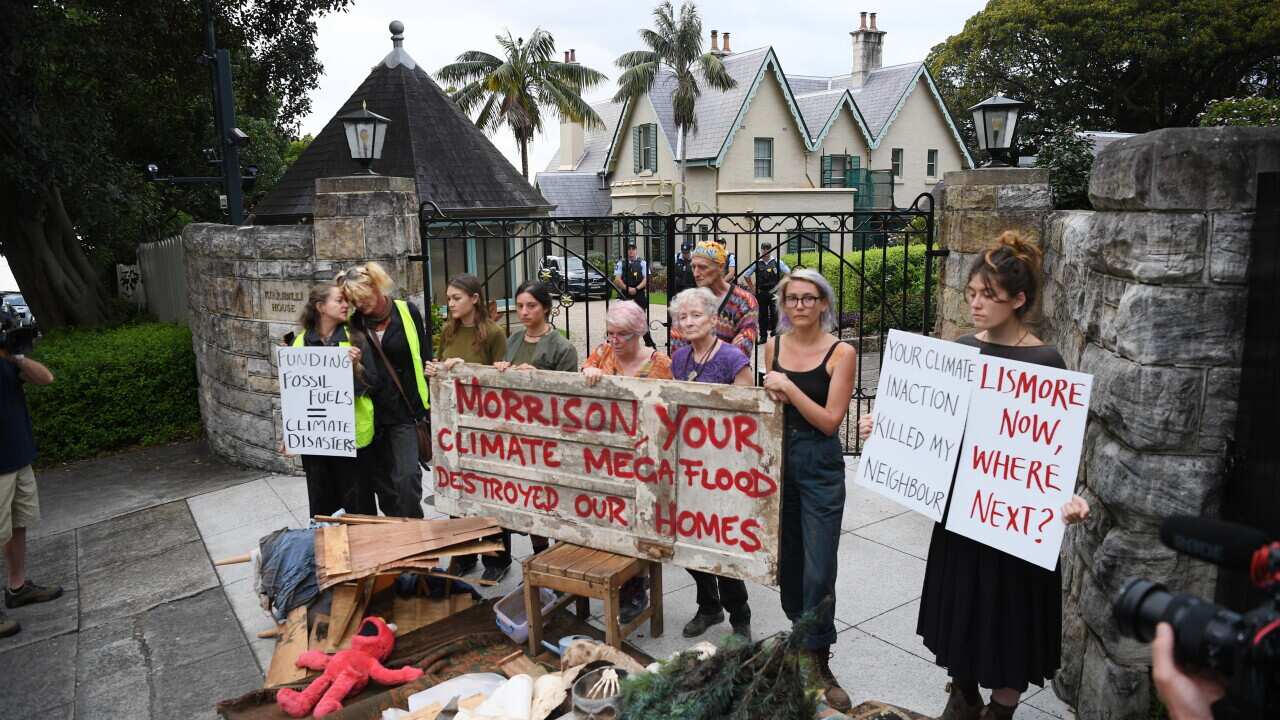 Flood affected residents of Lismore dump household flood damaged items outside the Prime Minister's residence of Kirribilli House in Sydney, Monday, March 21, 2022. (AAP Image/Dean Lewins) NO ARCHIVING
