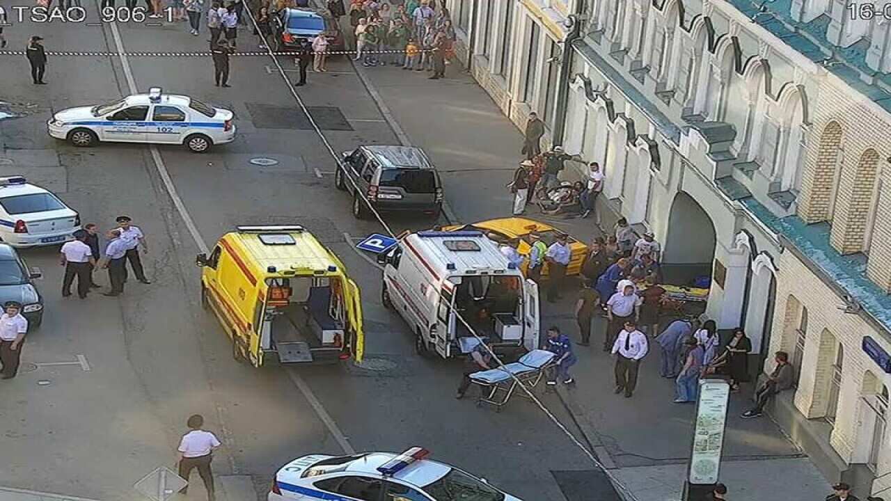 Emergency services treat the injured at the scene