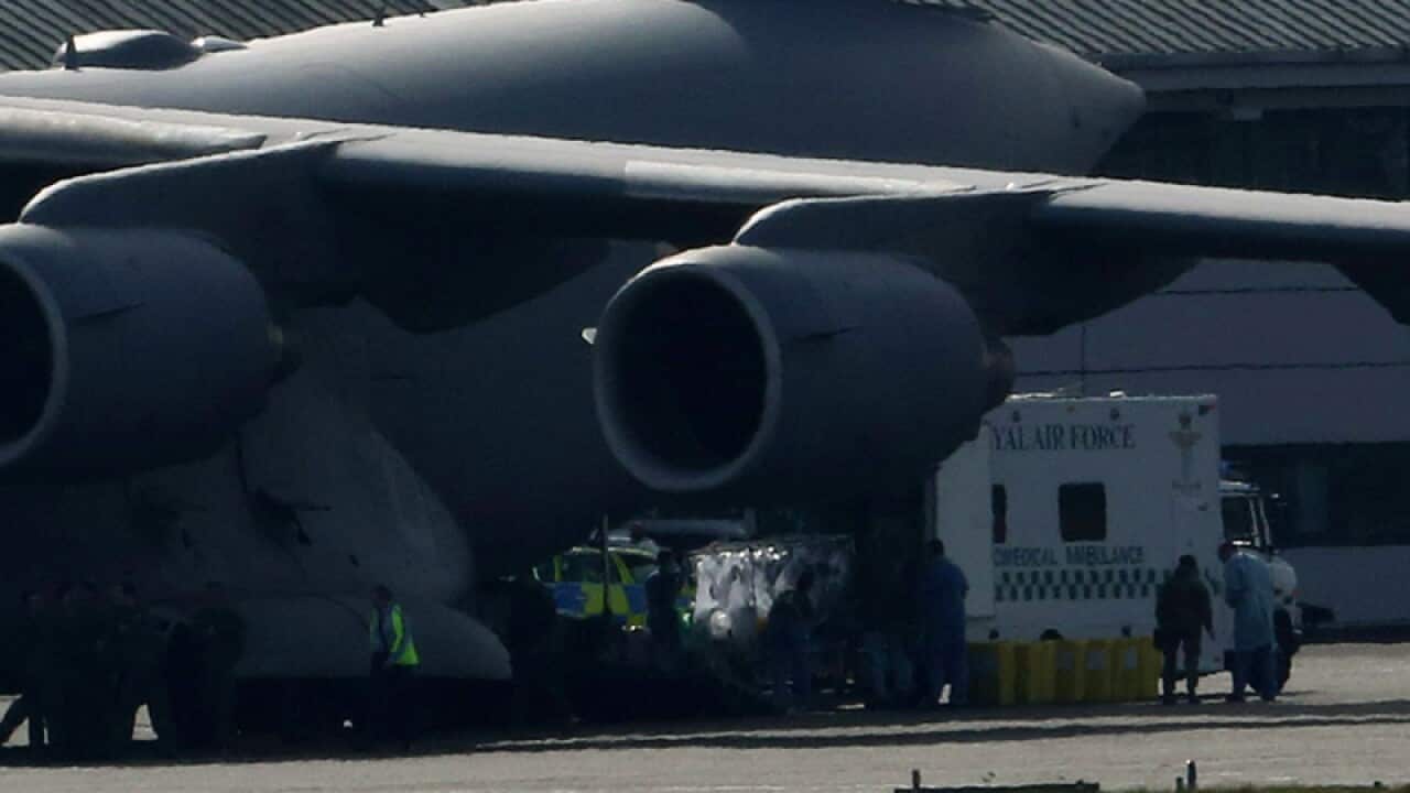 A British healthcare worker arrives in the UK from Sierra Leone