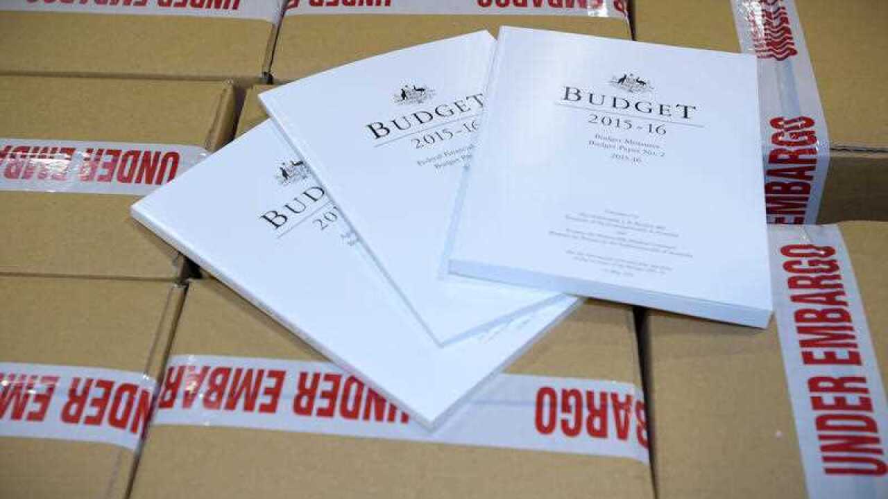 The 2015/16 Budget papers are seen as they are prepared at Canprint in Canberra.