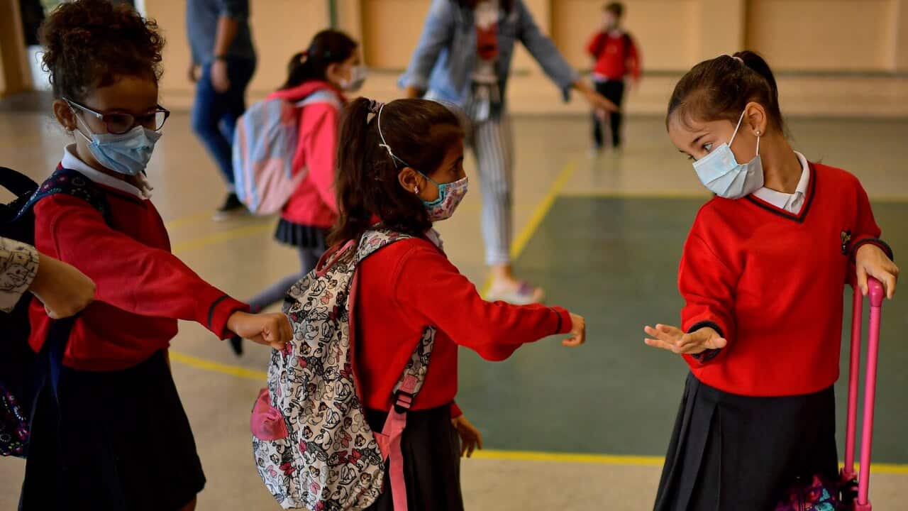 Young students waiting to go into school in Pamplona, northern Spain