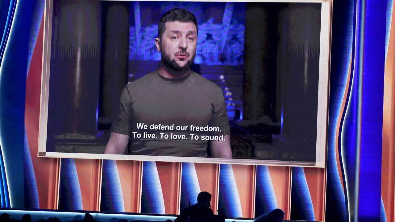 Ukraine's President Volodymyr Zelenskyy is seen speaking on screen.
