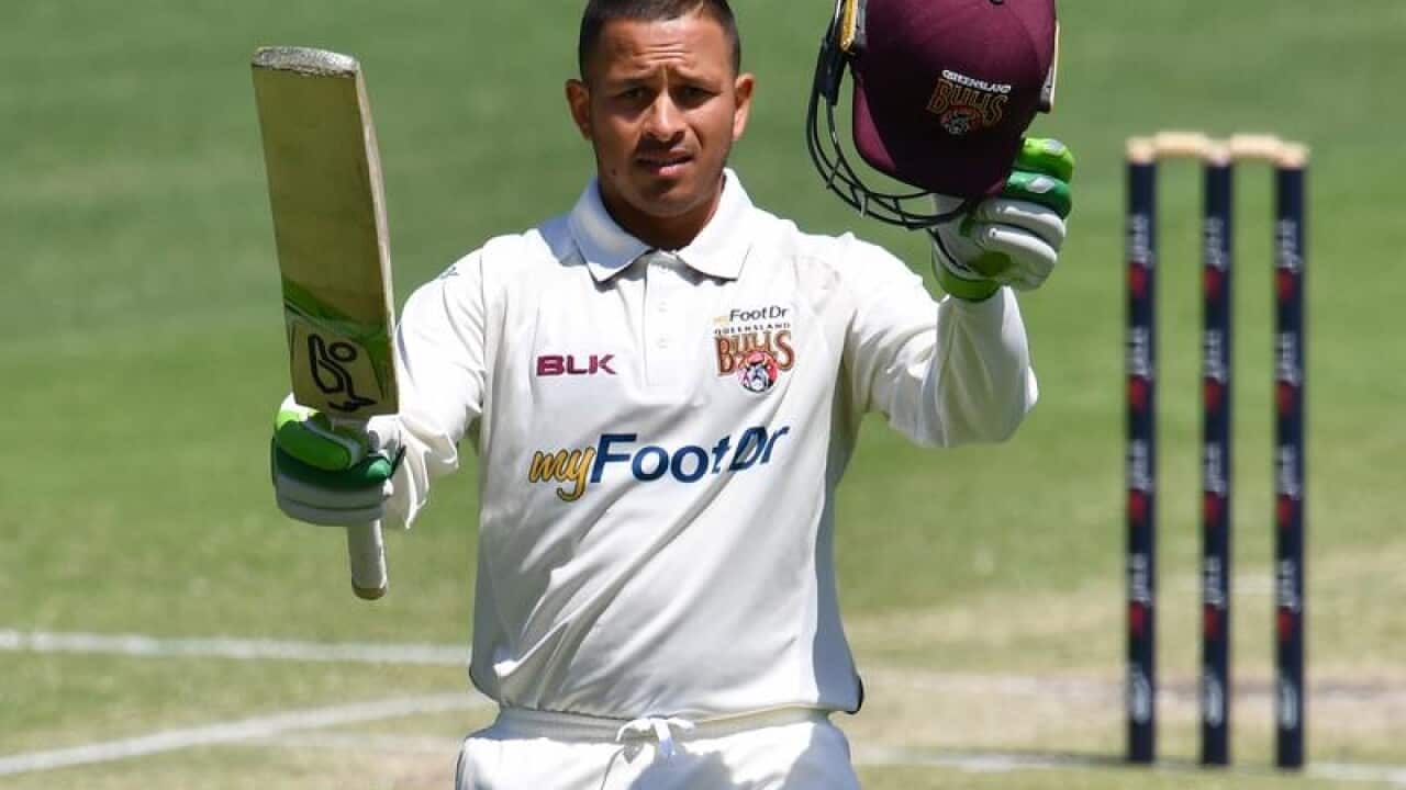 Usman Khawaja of Queensland celebrates his century