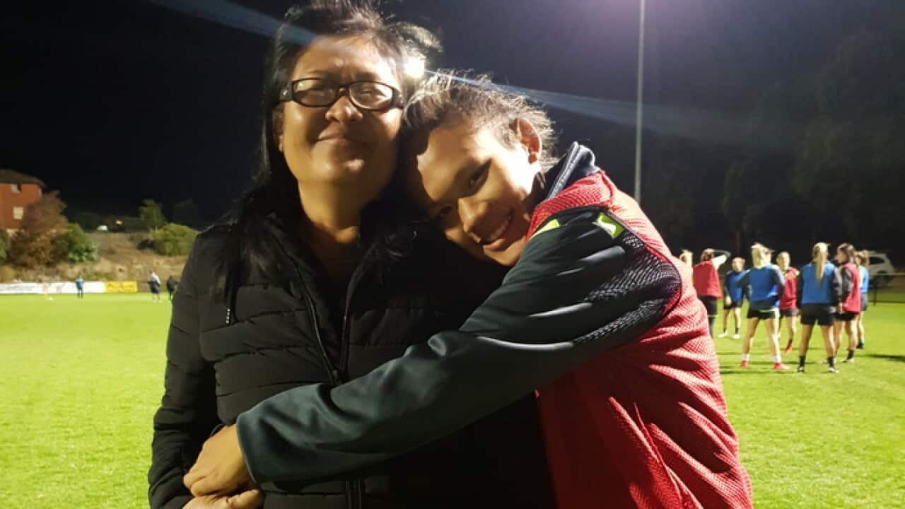 Rising football star Susan Phonsongkham and her mother Narumol Sultana.