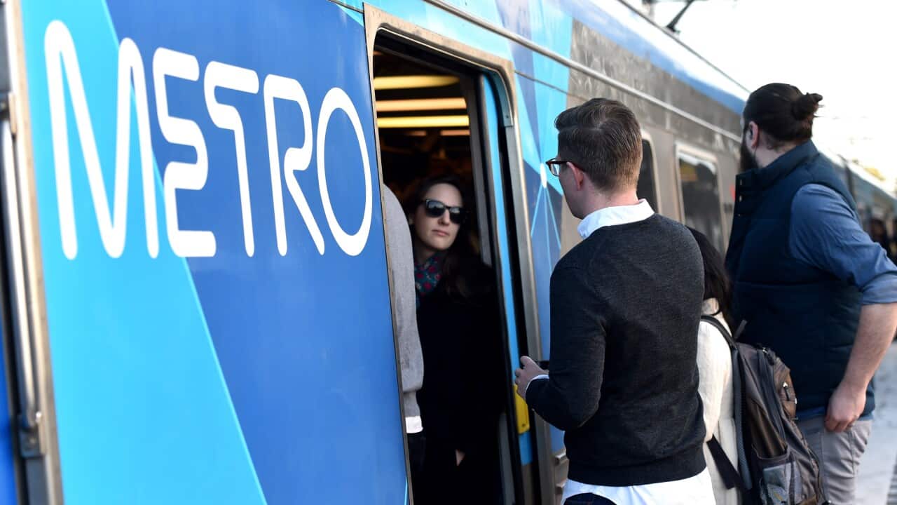 Peak hour commuters cram into a city loop train at Newmarket Station in Melbourne.