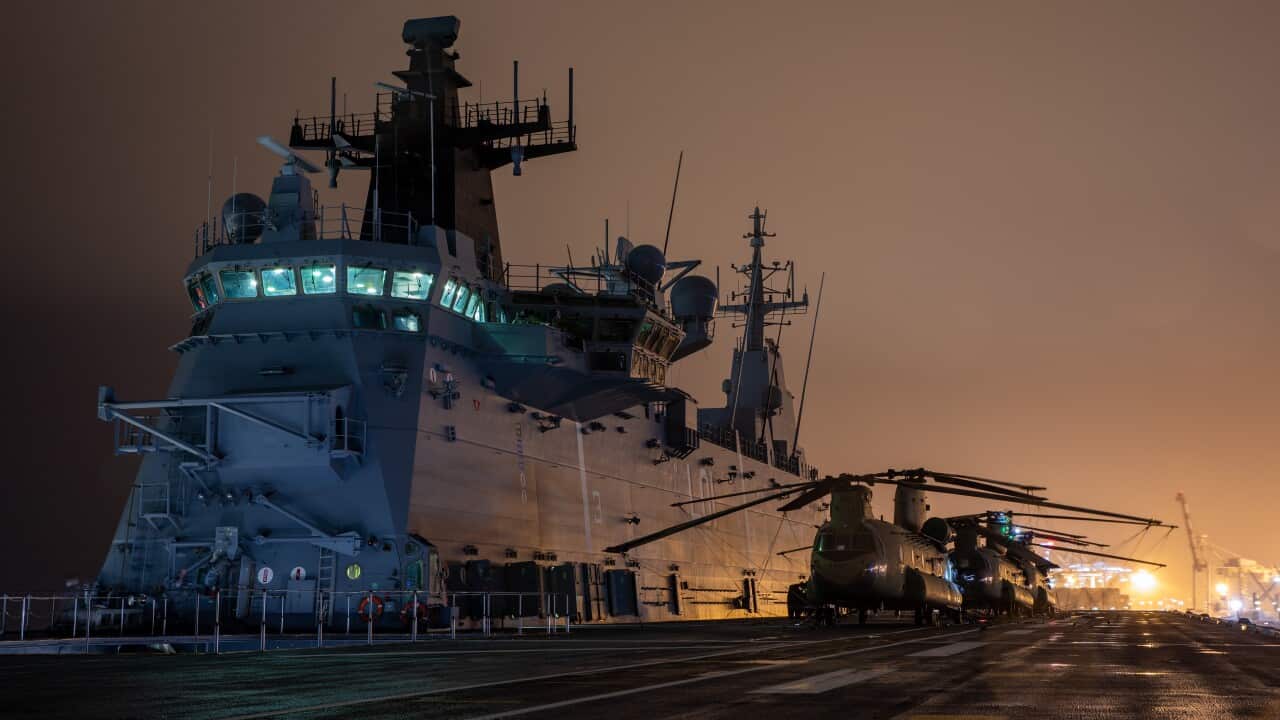 The HMAS Adelaide prepares to depart the Port of Brisbane and sail for Tonga to provide humanitarian supplies and assistance.