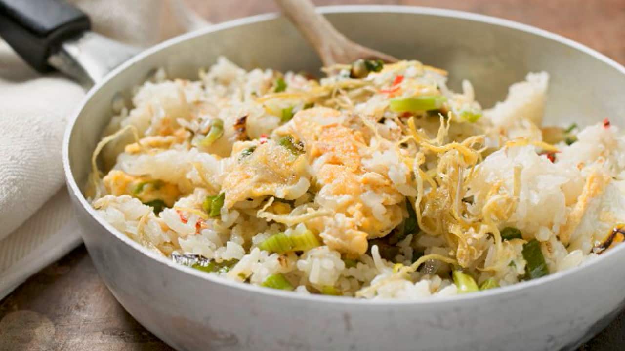 StockFood_00966743---Pan-cooked-rice-and-fish-and-lemon-zest.png