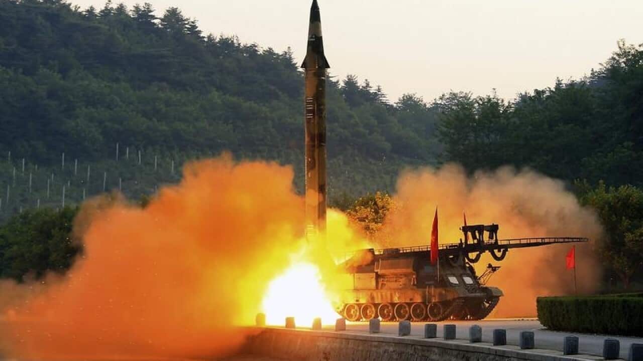 North Korea, shows the test-fire of a ballistic rocket