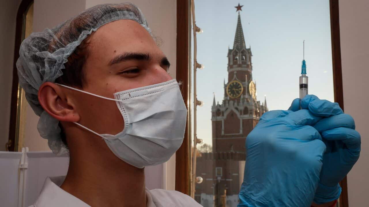 A nurse prepares a syringe with a dose of Russia's Sputnik V COVID-19 vaccine