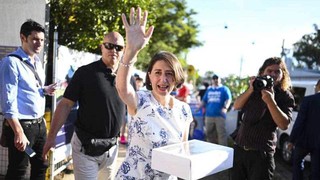 NSW Premier Gladys Berejiklian reacts after casting her vote at Willoughby Public School.