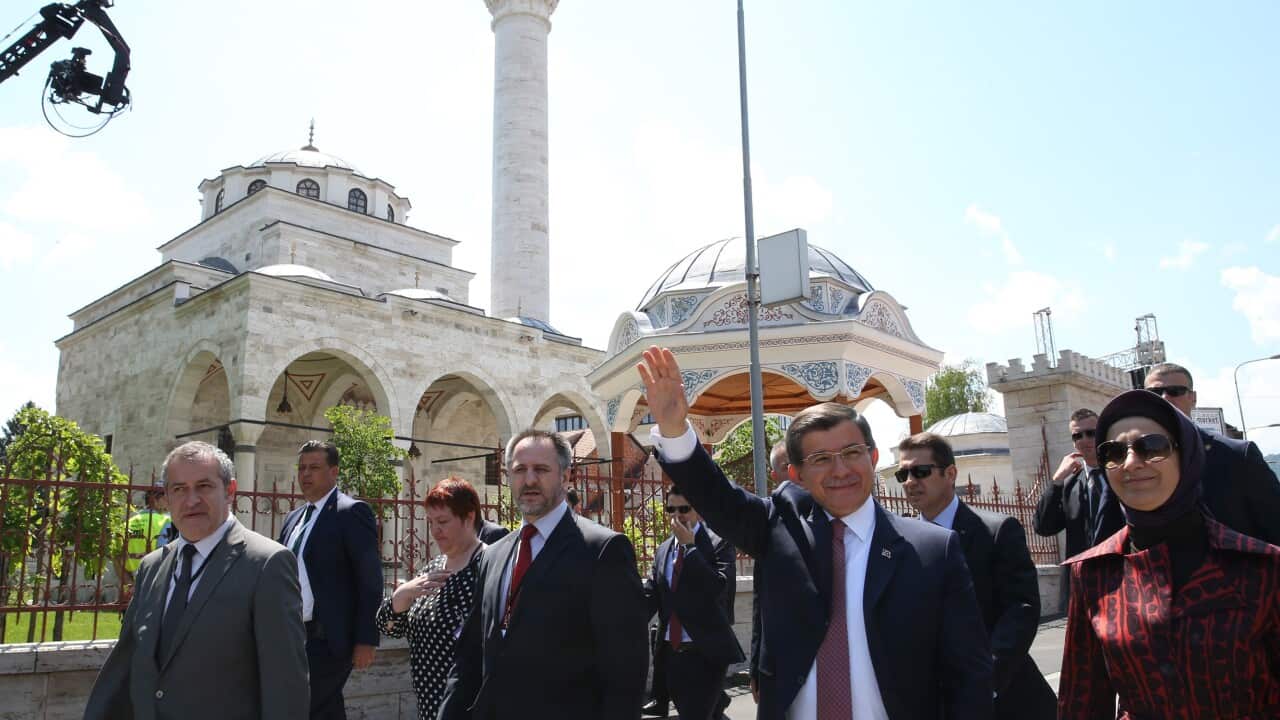 Turkish Prime Minister Ahmet Davutoglu (2nd R) attend the opening ceremony of Ferhadiye Mosque, demolished during war on May 7,1993
