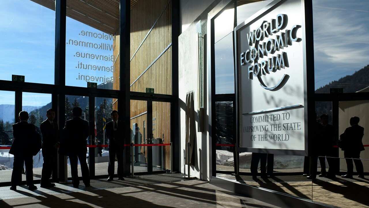 Businessmen cast shadows during the 48th annual meeting of the World Economic Forum, WEF, in Davos, Switzerland.