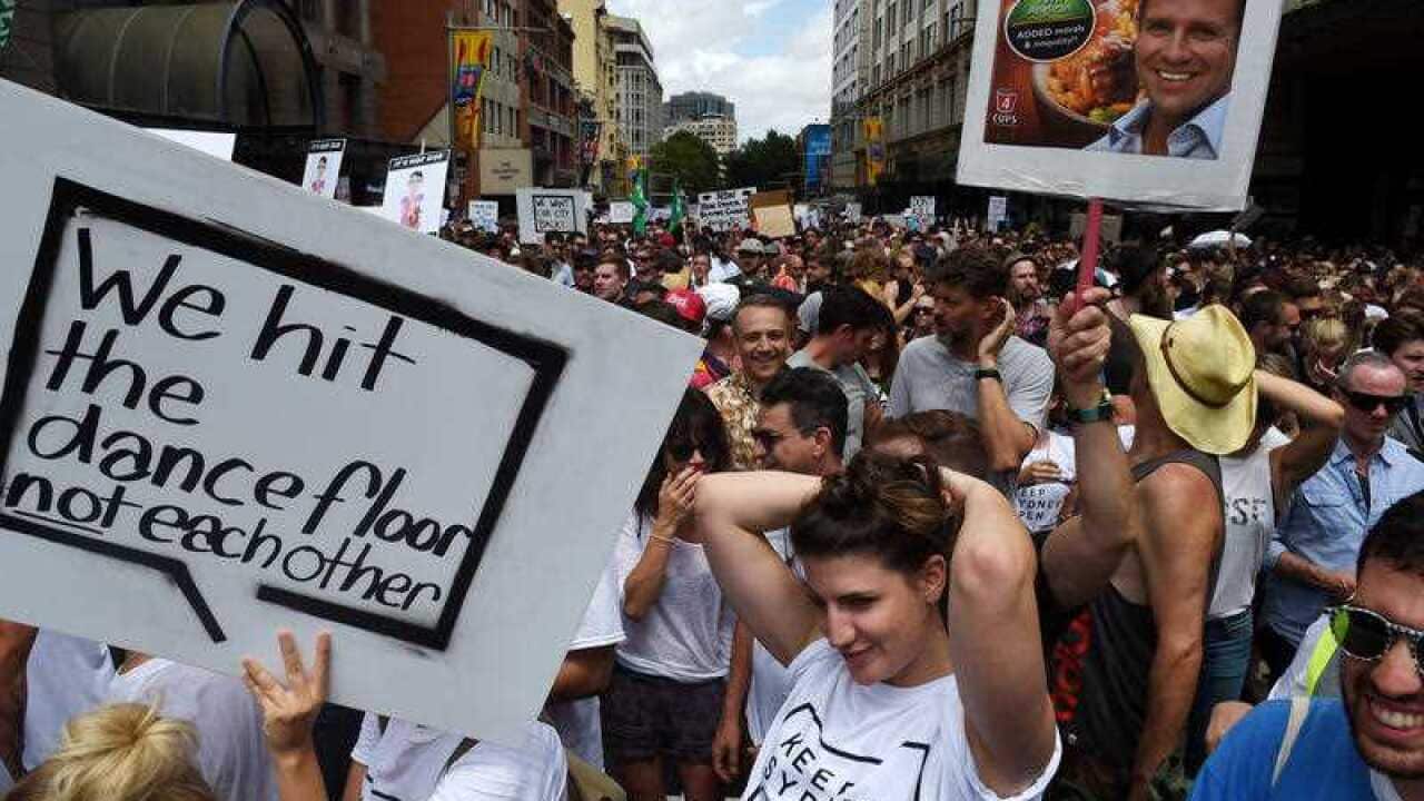 Demonstrators take part in protest rally against the NSW government's lockout laws and impact on nightlife in Sydney, Sunday, Feb. 21, 2016.