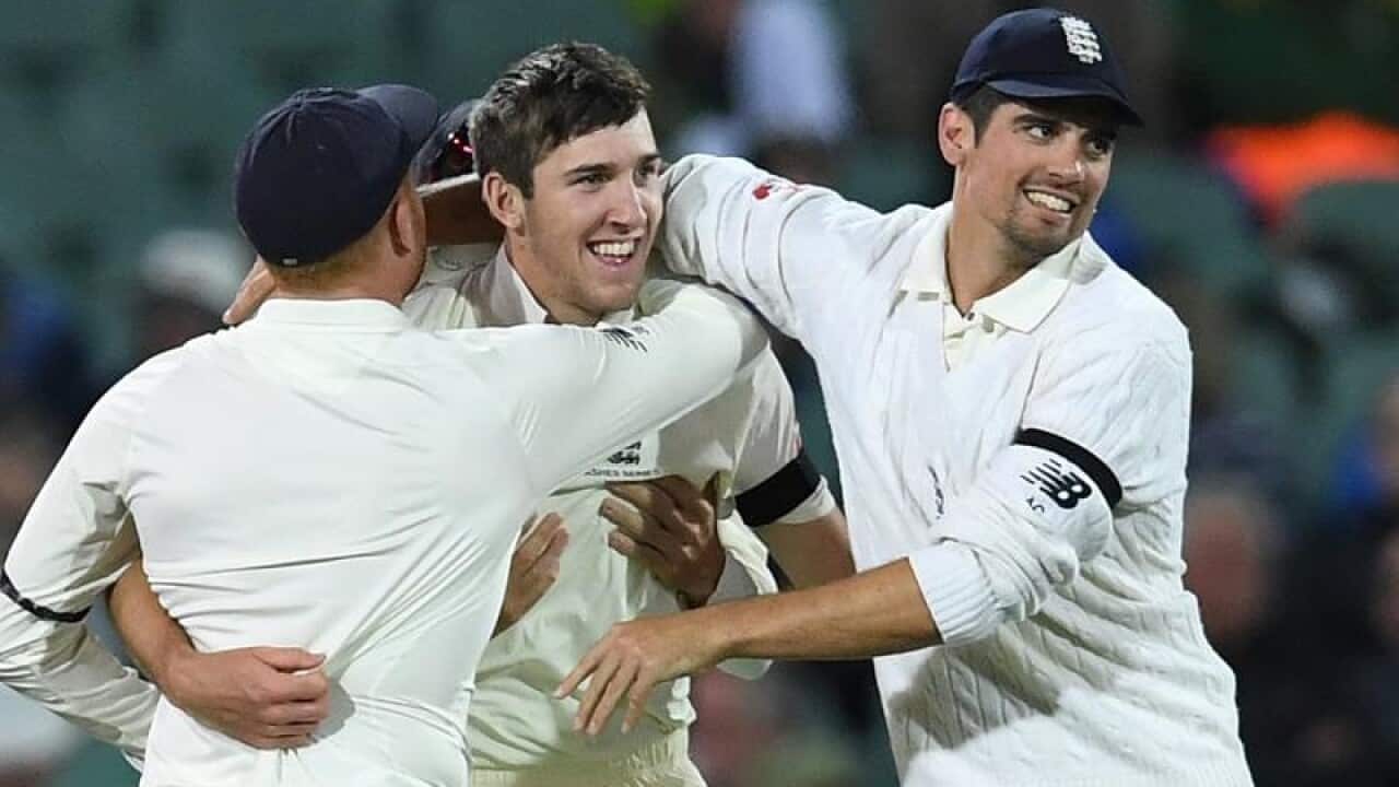 England bowler Craig Overton (centre).