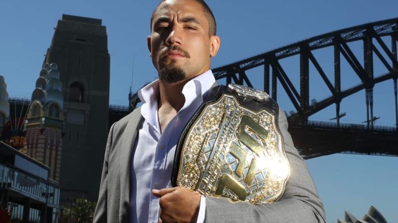 UFC Champion Robert Whittaker poses for a photograph.