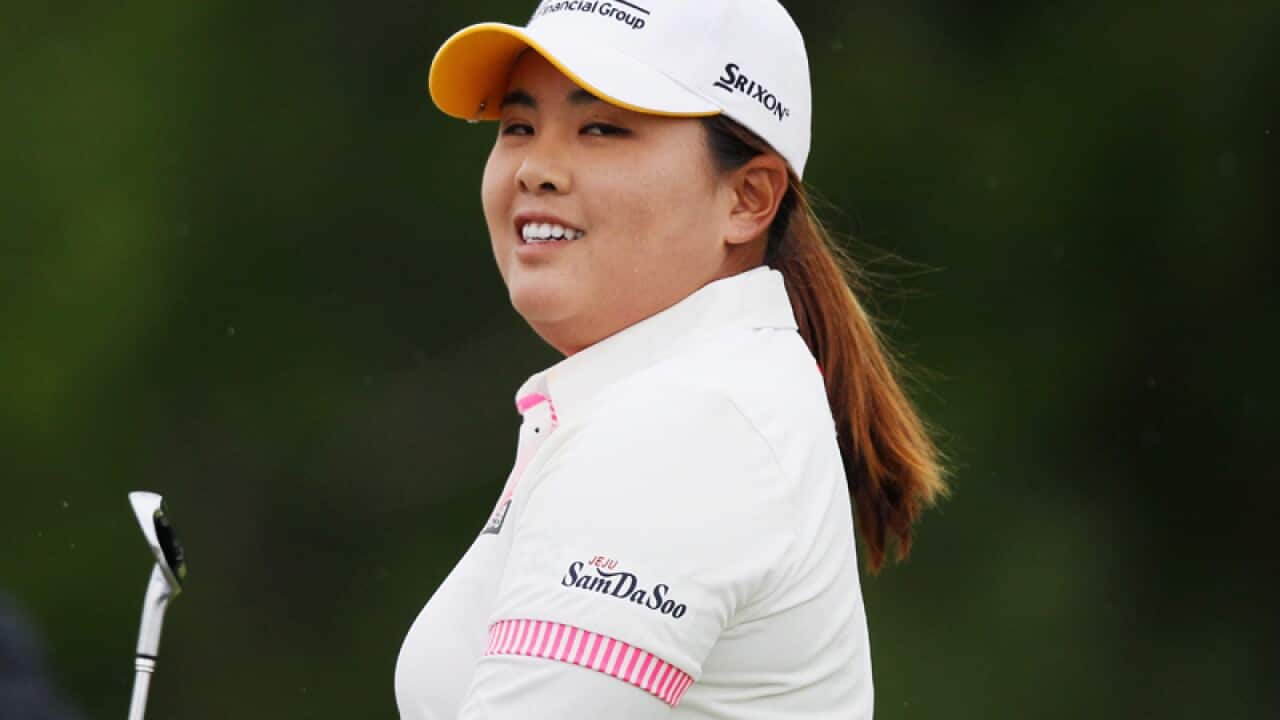Inbee Park smiles after her tee shot