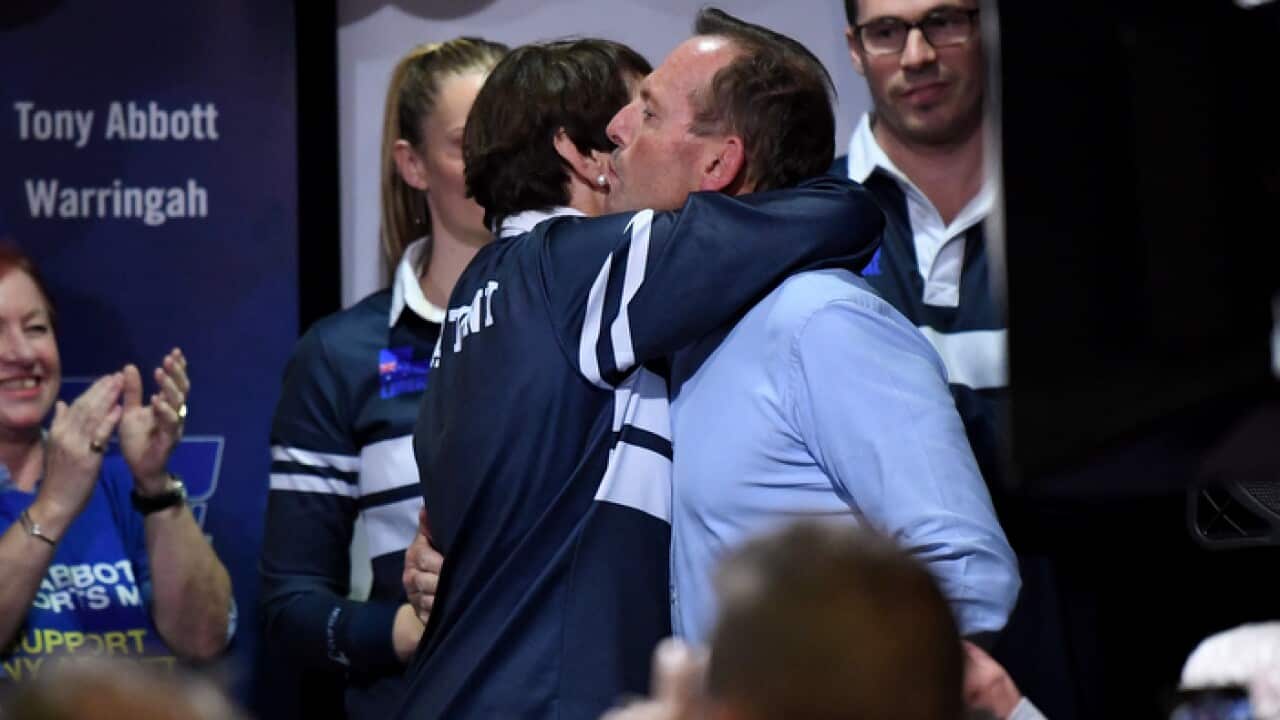 Former Prime Minister and Warringah Liberal candidate Tony Abbott kisses his wife Margie Abbott after conceding defeat