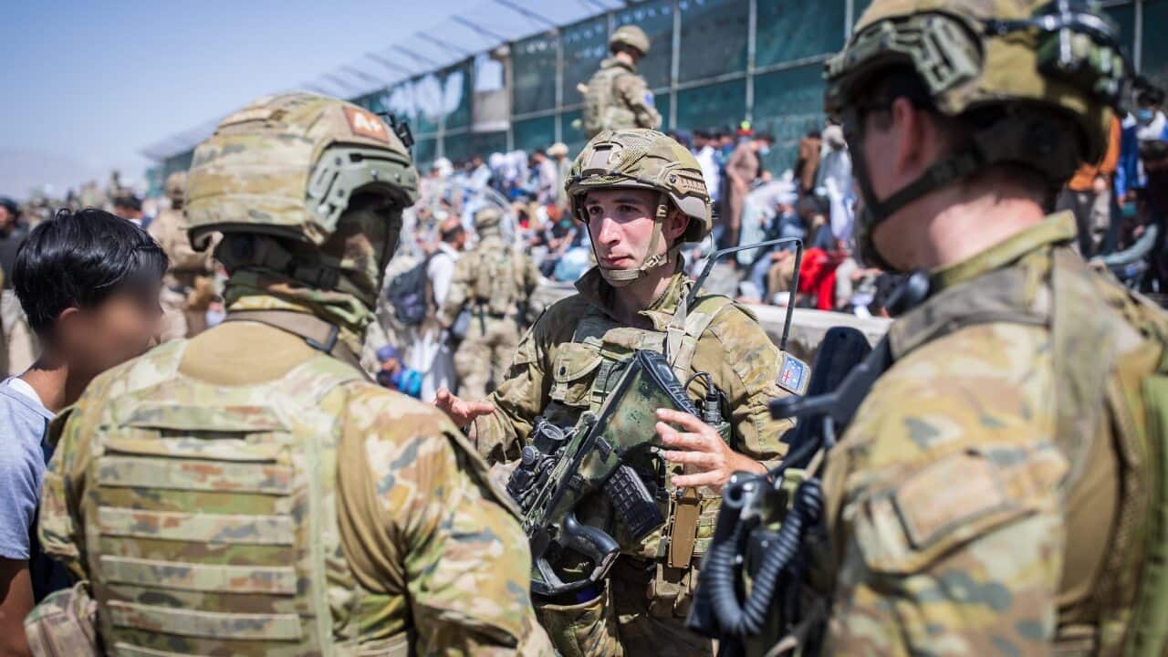 Members of the 1st Battalion, Royal Australian Regiment assist DFAT with locating Afghan Australian visa holders at Hamid Karzai International Airport