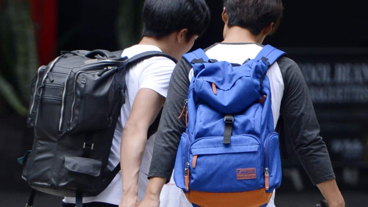 File photo of backpackers in Sydney