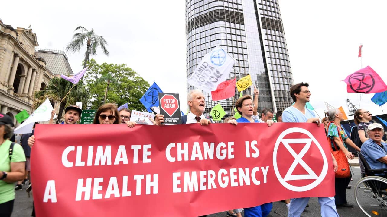 Extinction Rebellion protesters demonstrate outside the Queensland Parliament House in Brisbane, Tuesday, February 4, 2020. (AAP Image/Dan Peled) NO ARCHIVING