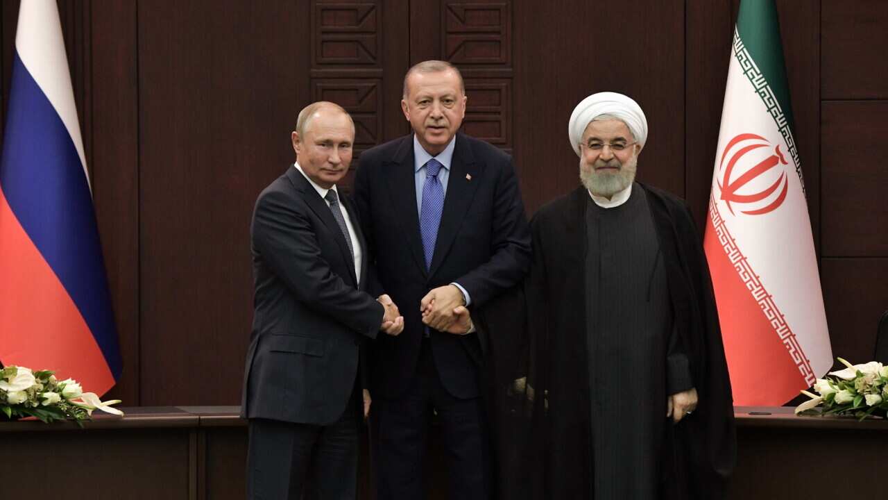 (L-R) Russian President Vladimir Putin, Turkish President Recep Tayyip Erdogan and Iranian President Hassan Rouhani in Ankara