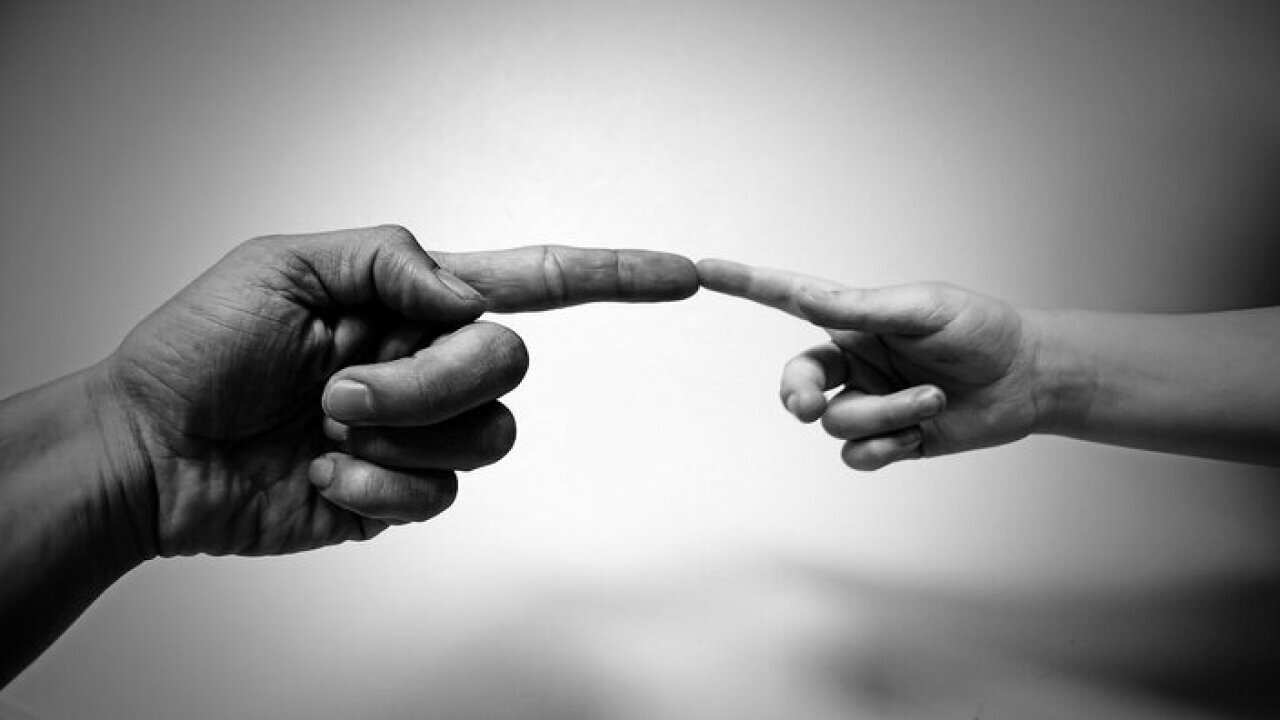 Adult and child hands