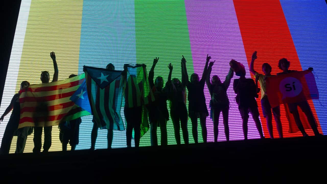 People wave Catalonian independence flags at the end of the 'Yes' vote campaign in Barcelona.