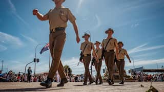 A photo of five Australian soldiers in ceremonial dress commemorating ANZAC day.