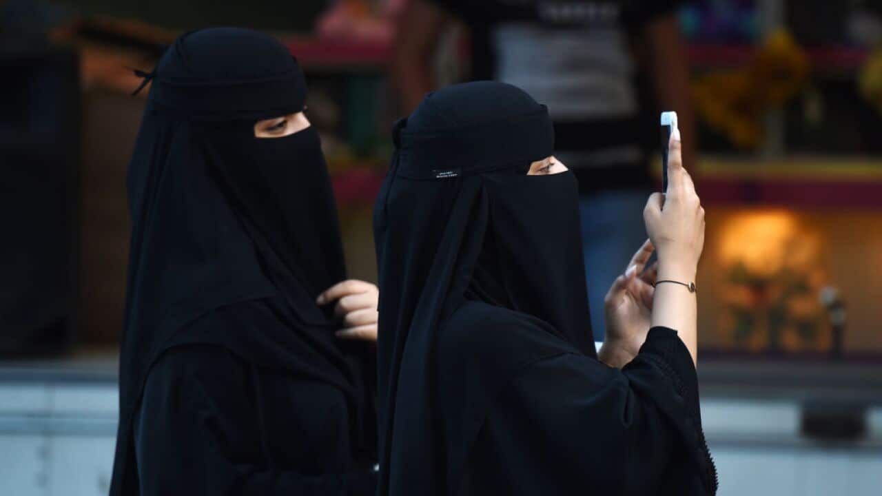 Women walk on Tahlia street in the Saudi capital Riyadh on September 24, 2017, during celebrations for the anniversary of the founding of the kingdom. / AFP PHOTO / Fayez Nureldine (Photo credit should read FAYEZ NURELDINE/AFP/Getty Images)