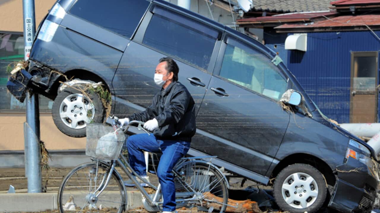 Biker_Car_Japan_Aftermath_140311_B_Getty_2001490014