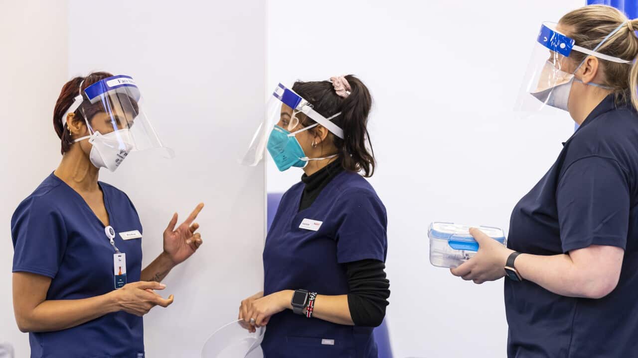 Health care workers at a COVID vaccination hub at the Heidelberg Repatriation Hospital in Melbourne.