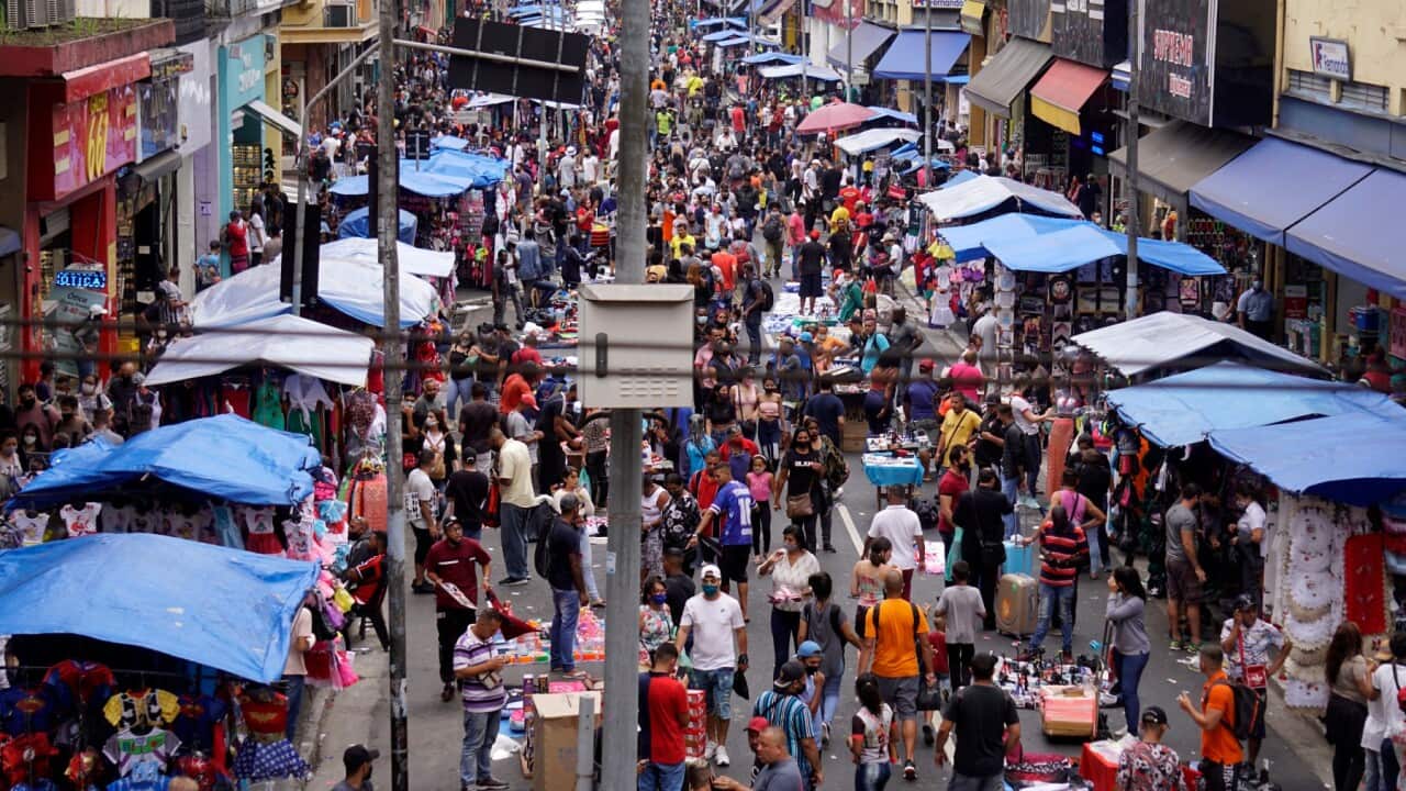 People walk in a popular street market before Christmas, amid the coronavirus disease (COVID-19) outbreak, in São Paulo, Brazil, December 24, 2020