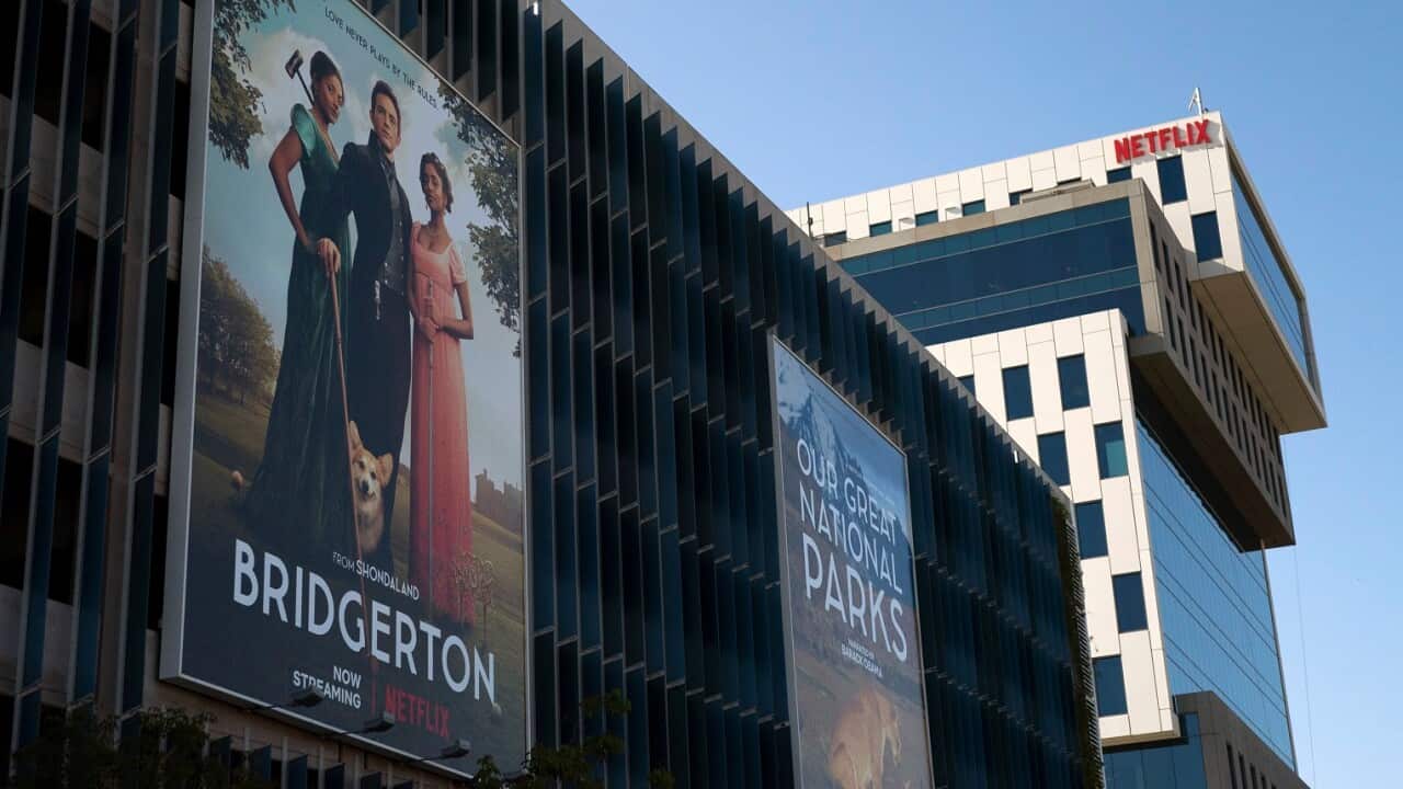 An advertisement for Netflix's popular show Bridgerton is seen outside its office building in Los Angeles, Wednesday, April 20, 2022.