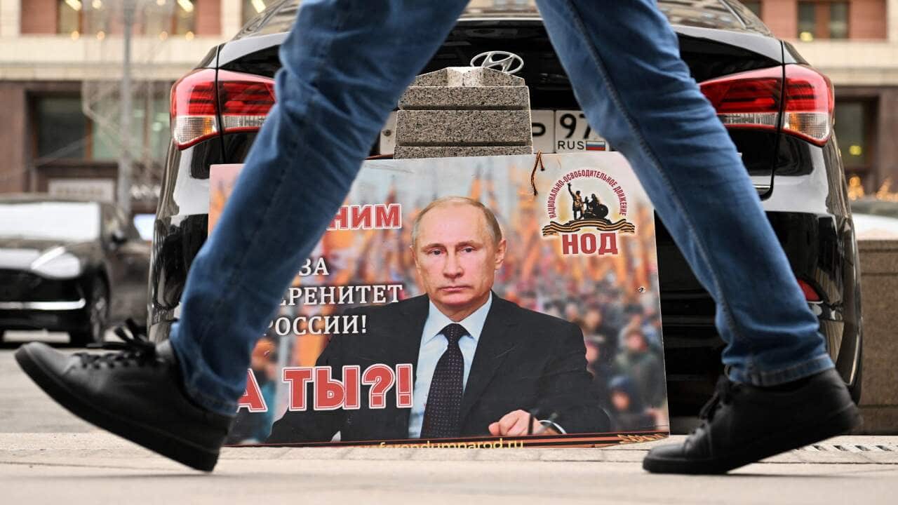 A placard featuring an image of Russian President Vladimir Putin.