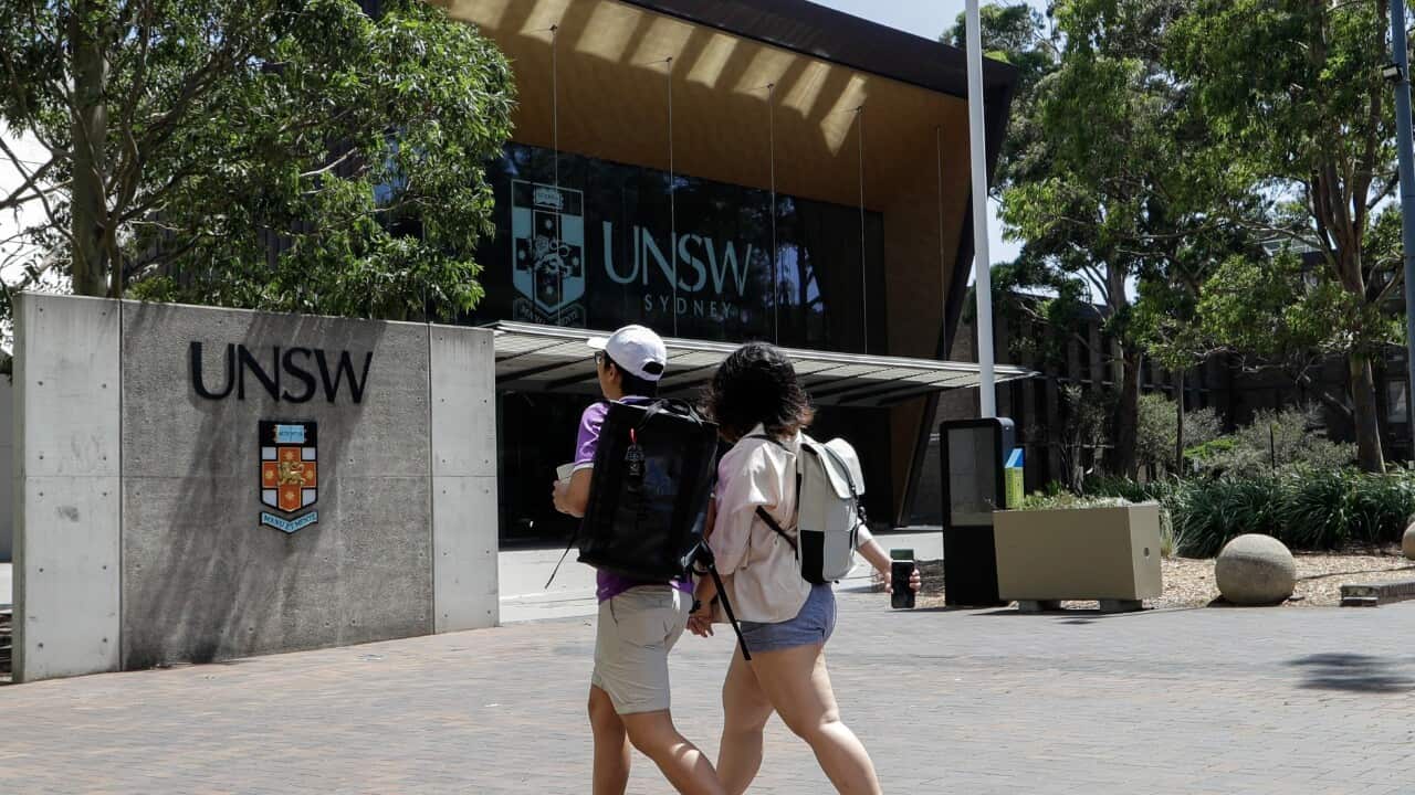 Students walk around the University of New South Wales campus in Sydney, Australia,