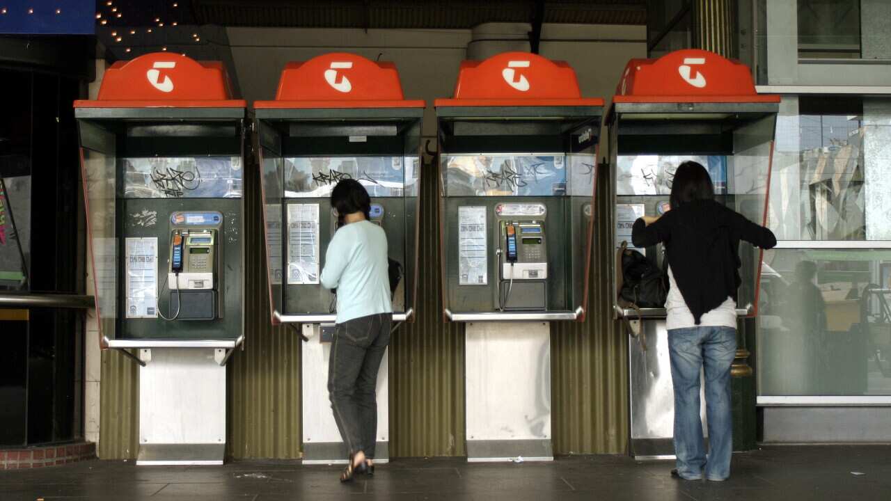 Telstra phone booths at Flinders Street station, Melbourne. (AAP Image/Simon Mossman) NO ARCHIVING
