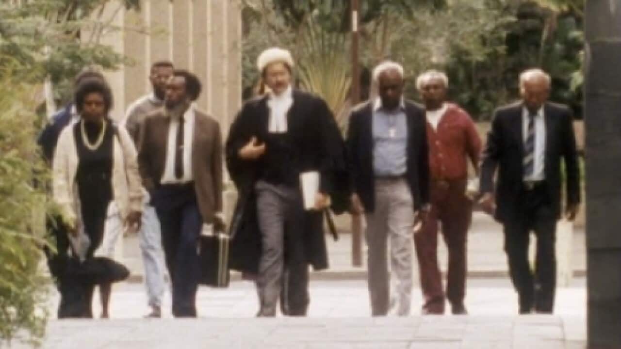 Eddie Mabo walking with his team of lawyers in his case, which saw the High Court overturn the legal doctrine of terra nullius