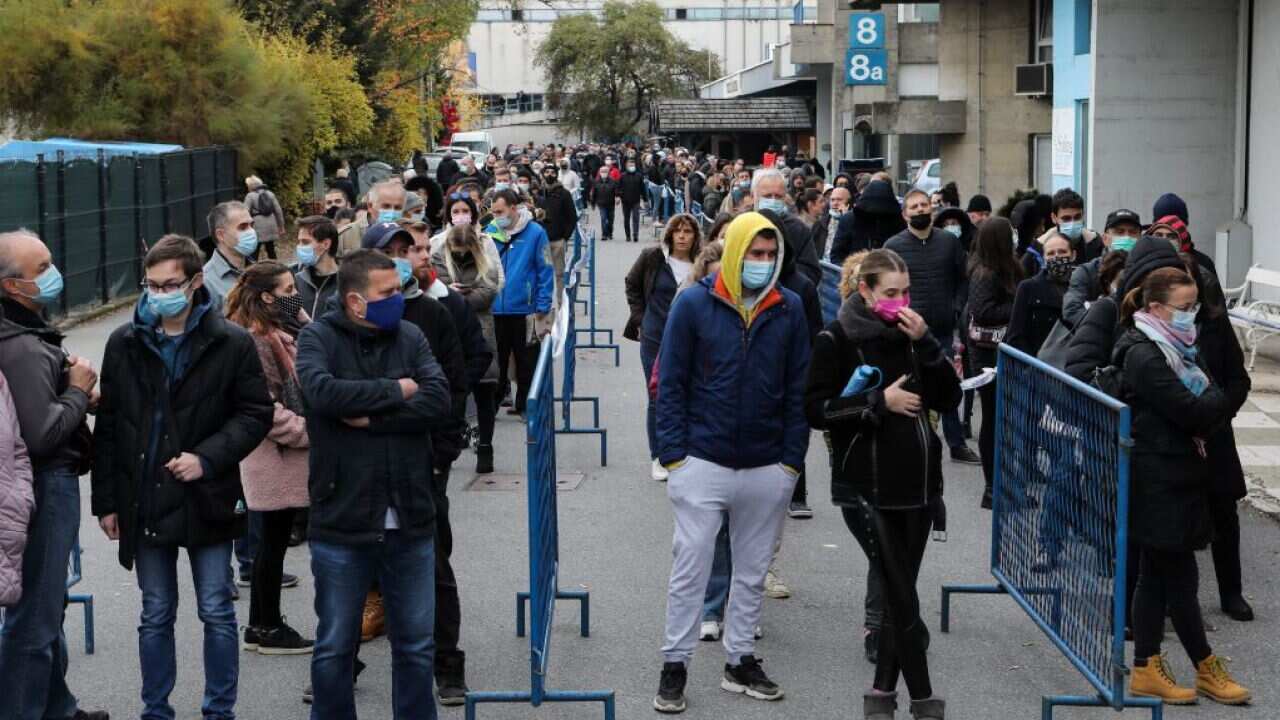People wait in lines to get vaccinated against COVID-19 in Zagreb, Croatia, Nov. 6, 2021.