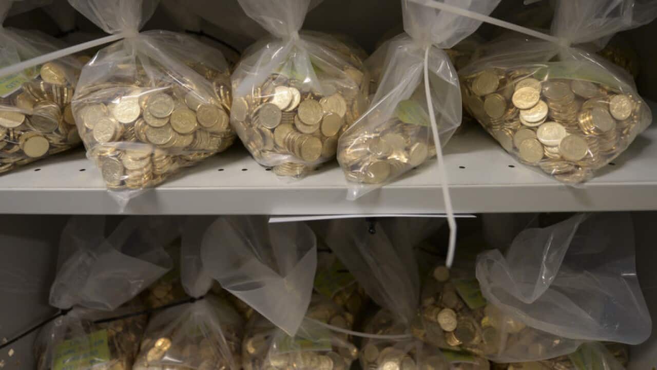 Bags of newly struck coins are stored at the coin production factory at the Royal Australian Mint in Canberra, Wednesday, April 16, 2014. (AAP Image/Lukas Coch) NO ARCHIVING
