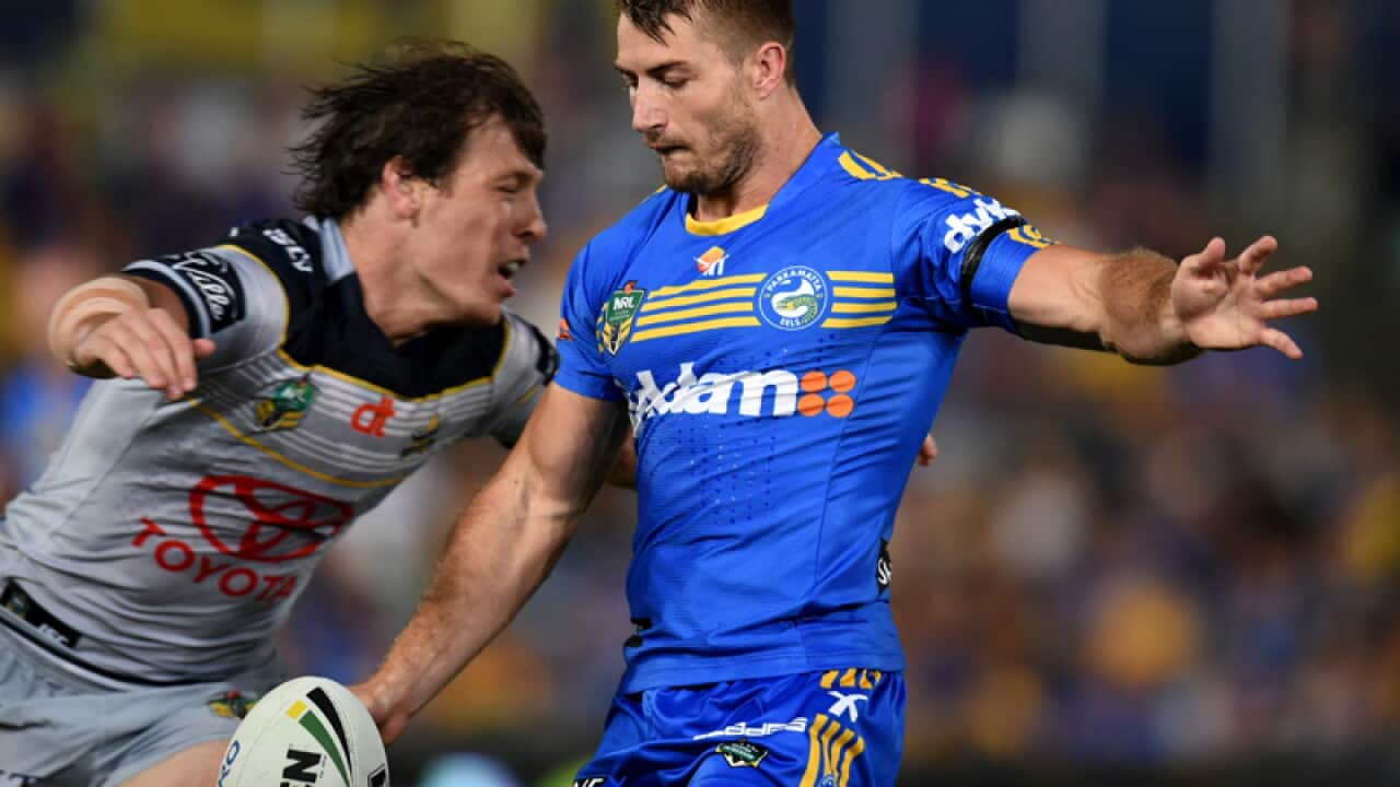 Kieran Foran (R)of the Eels about to be tackled by Rory Kostjasyn