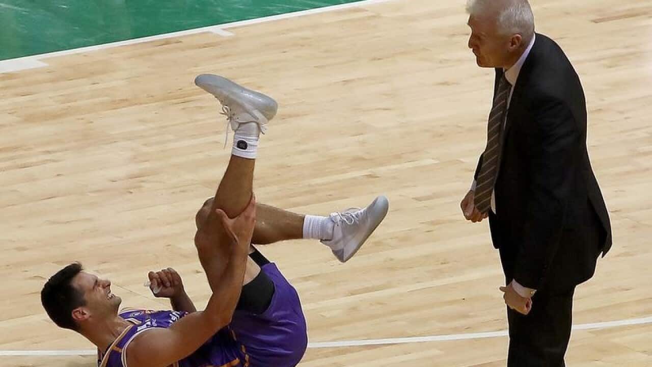 Kevin Lisch of the Kings falls after being injured